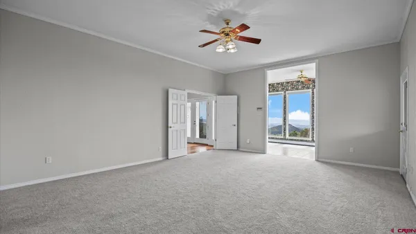 a view of an empty room with a balcony
