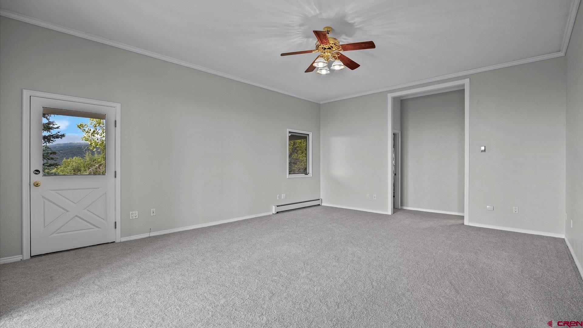 20508 Green Valley Road Cedaredge, CO 81413 - Photo 24 of 42 a view of an empty room with a window