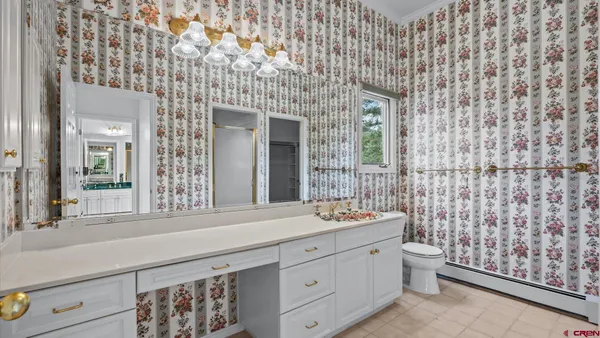 a bathroom with a sink and a large mirror