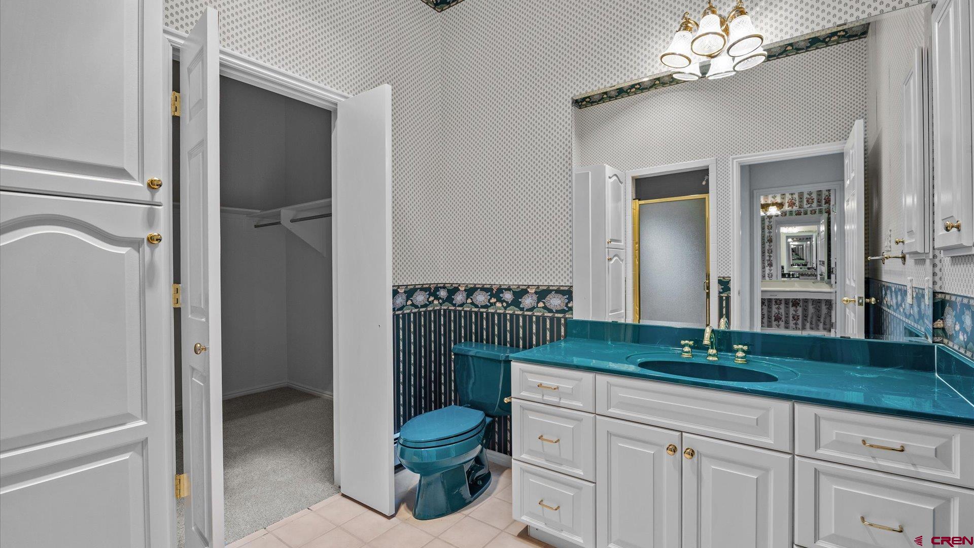 20508 Green Valley Road Cedaredge, CO 81413 - Photo 26 of 42 a bathroom with a sink and a large mirror