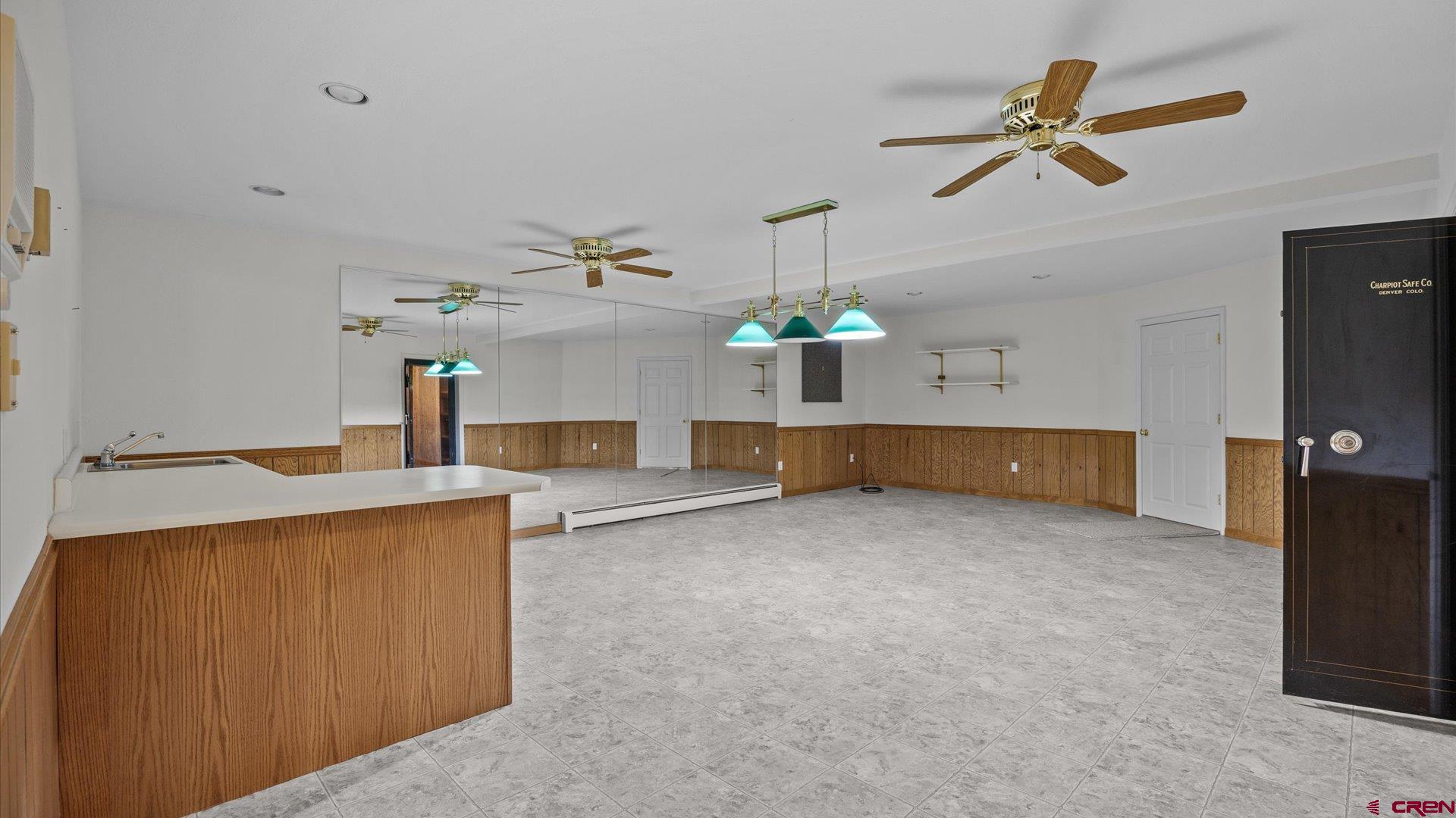 20508 Green Valley Road Cedaredge, CO 81413 - Photo 28 of 42 a living room with furniture and a chandelier