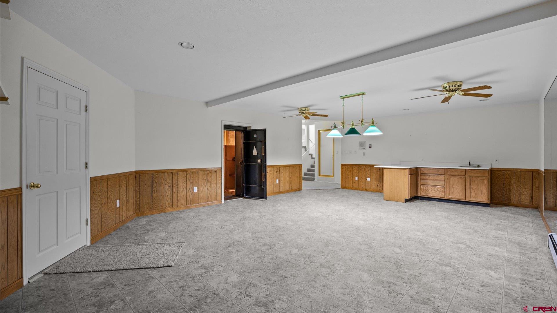 20508 Green Valley Road Cedaredge, CO 81413 - Photo 29 of 42 a view of a livingroom with a staircase