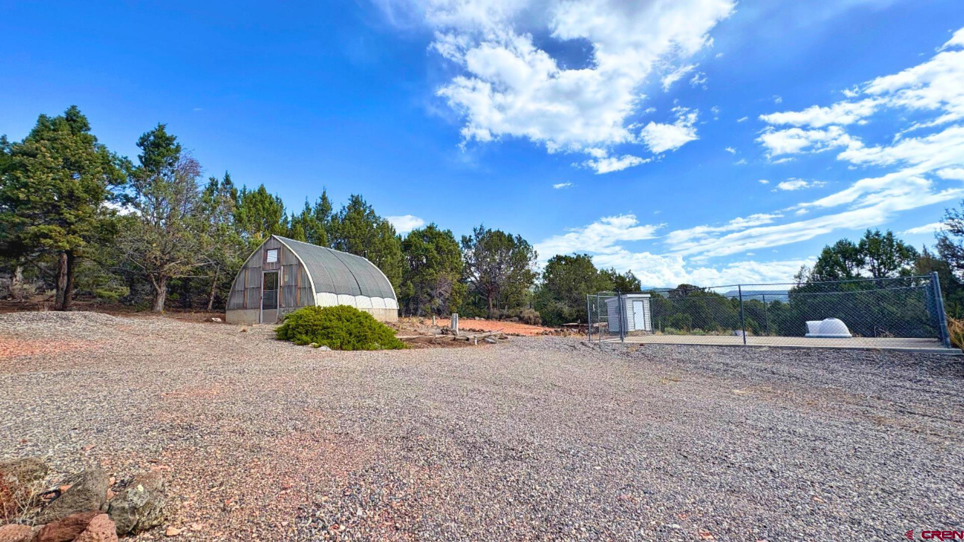 20508 Green Valley Road Cedaredge, CO 81413 - Photo 40 of 42 a view of a backyard of a house
