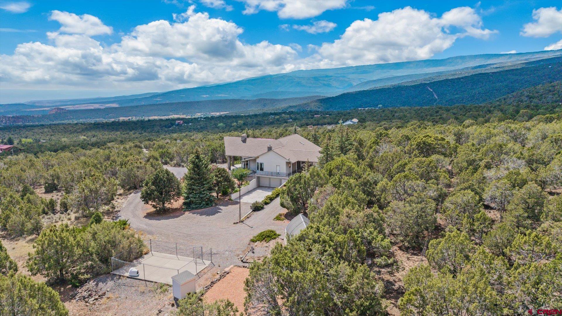 20508 Green Valley Road Cedaredge, CO 81413 - Photo 41 of 42 a view of a lake with a building in the background