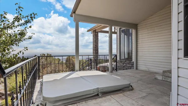 a view of a balcony with trees