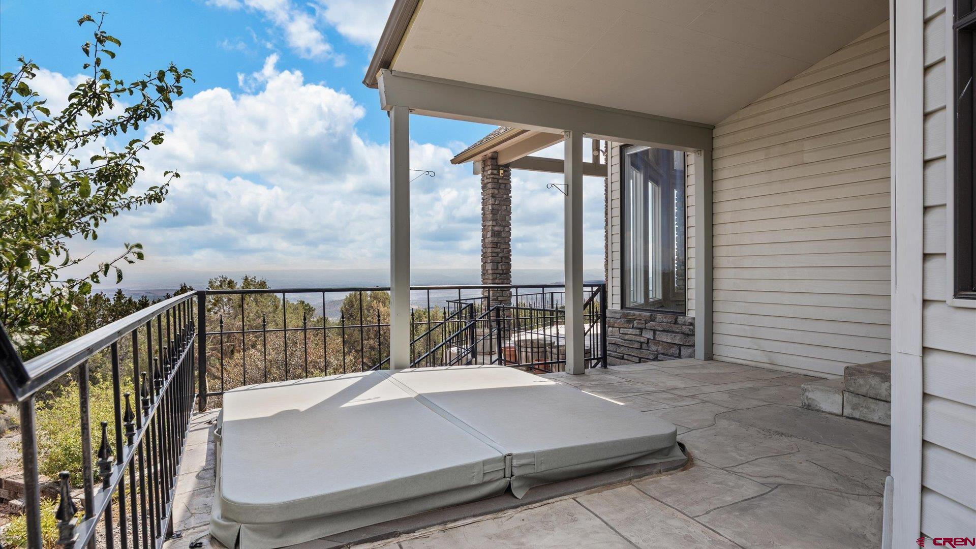 20508 Green Valley Road Cedaredge, CO 81413 - Photo 6 of 42 a balcony with chairs