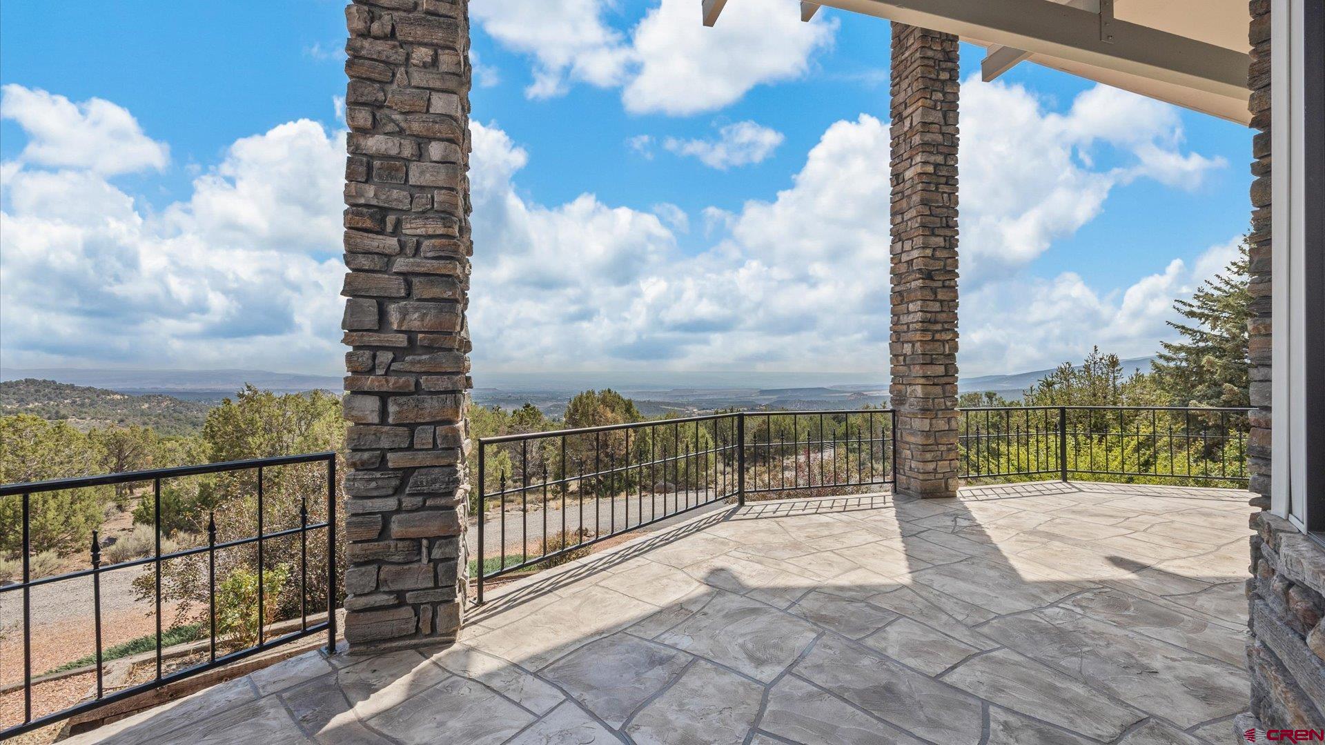 20508 Green Valley Road Cedaredge, CO 81413 - Photo 7 of 42 a view of a balcony with trees