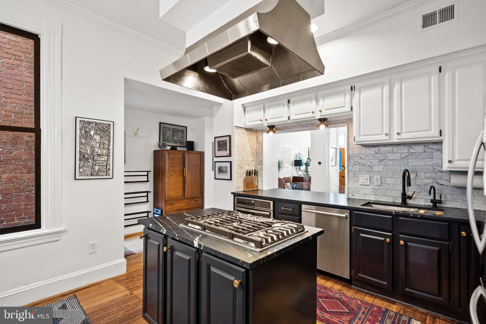 2026 15th Street Northwest Washington, DC 20009 - Photo 16 of 47 a kitchen with a stove and a refrigerator