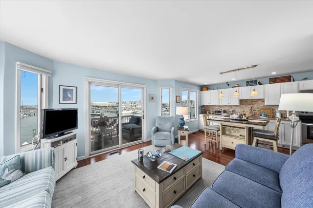 a kitchen with granite countertop a sink and cabinets
