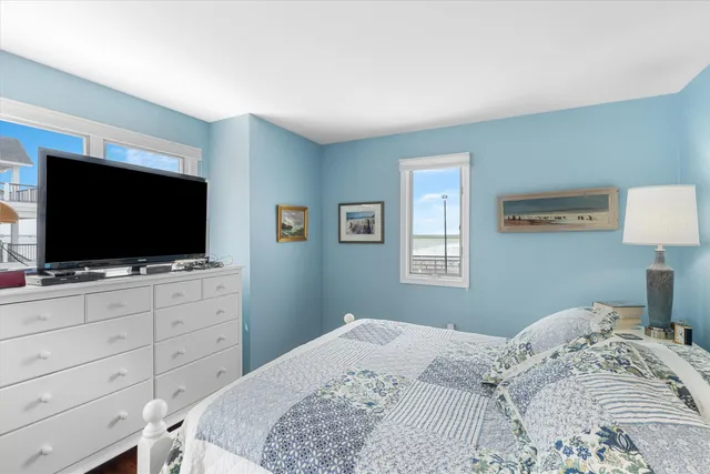 a bedroom with bed and window