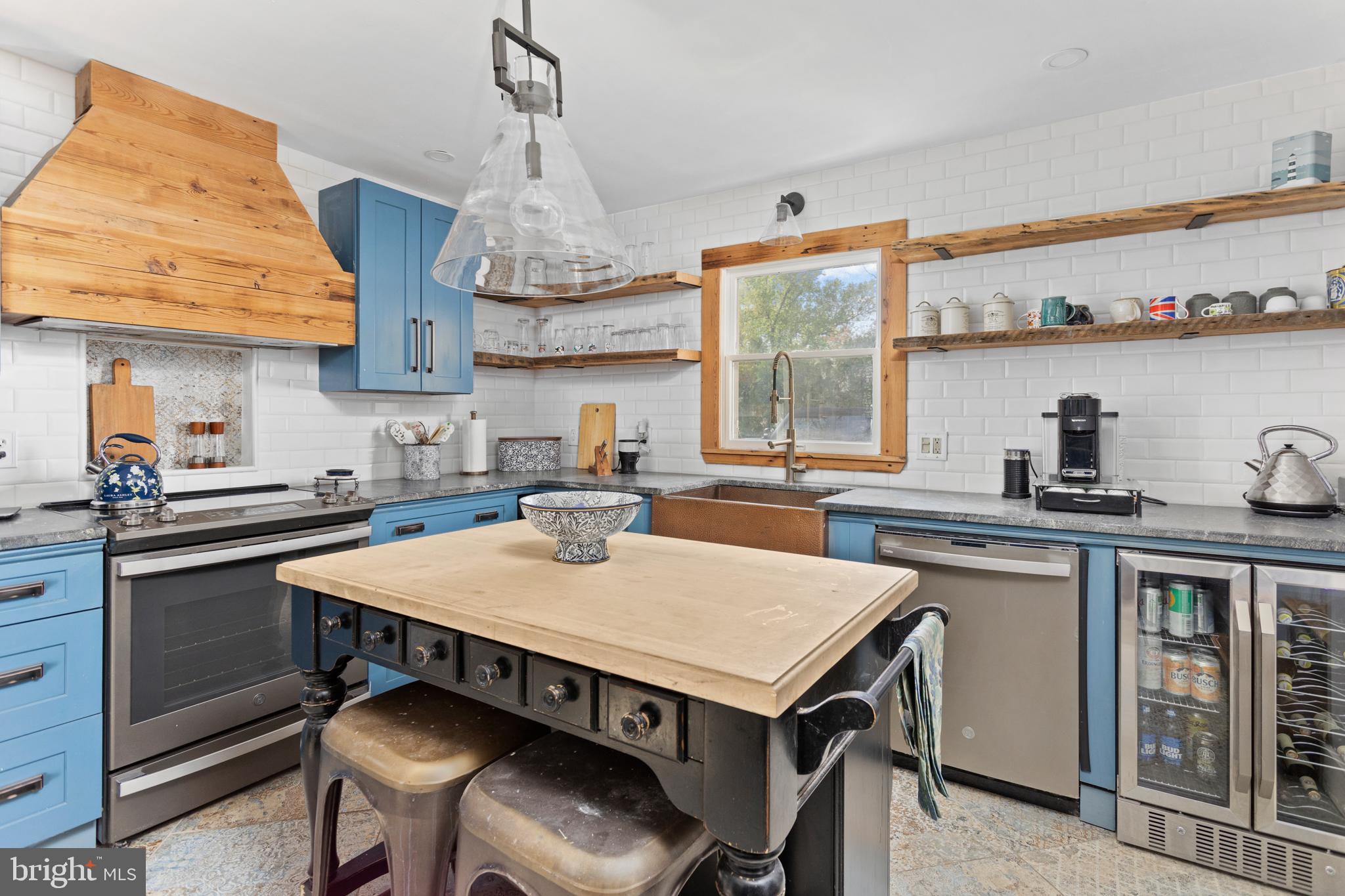 942 Province Line Road Allentown, NJ 08501 - Photo 23 of 50 a kitchen with a table chairs stove and cabinets