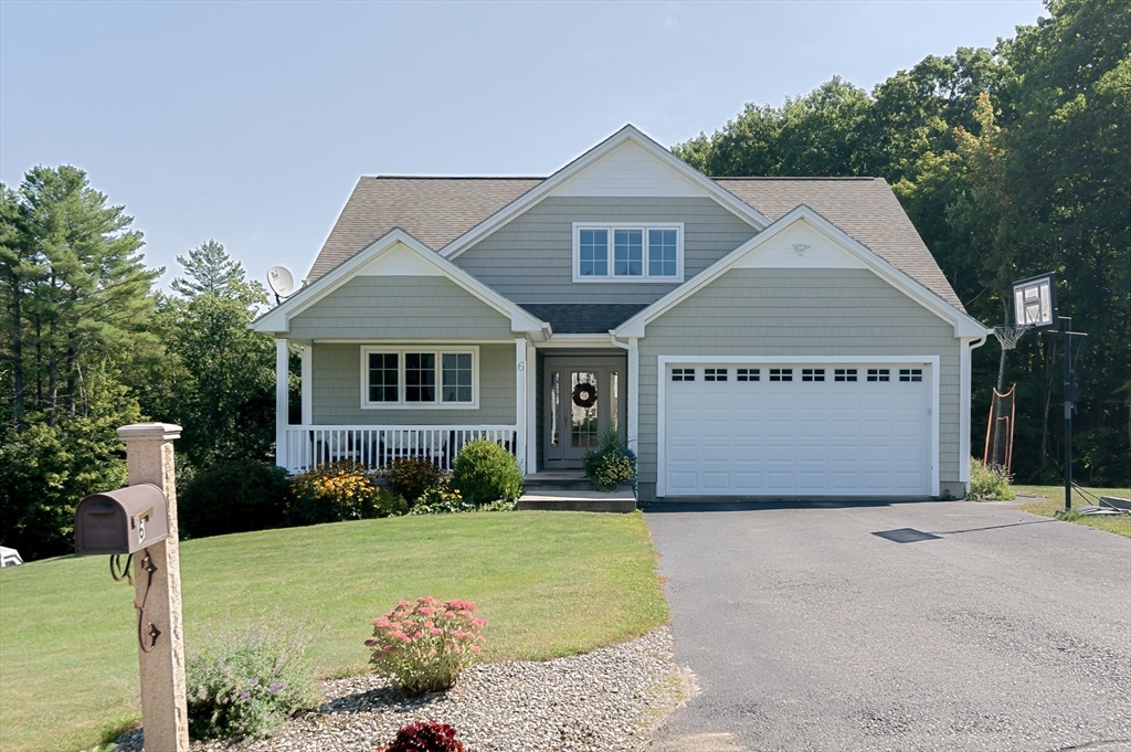 6 Carlson's Way Rutland, MA 01543 - Photo 1 of 34 a front view of a house with garden