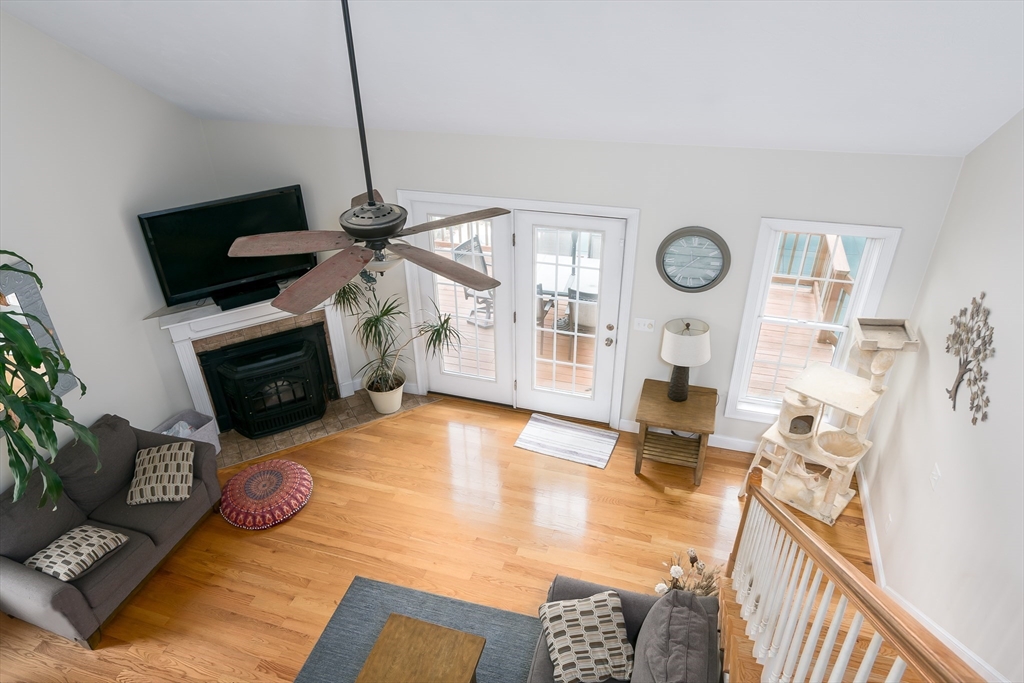 6 Carlson's Way Rutland, MA 01543 - Photo 11 of 34 a living room with furniture a flat screen tv and a fireplace