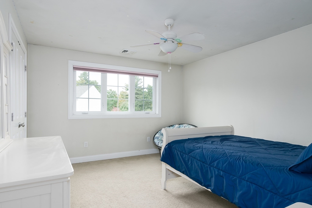 6 Carlson's Way Rutland, MA 01543 - Photo 16 of 34 a bedroom with a bed and a sink