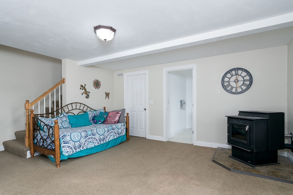 6 Carlson's Way Rutland, MA 01543 - Photo 22 of 34 a living room with furniture and a baby crib