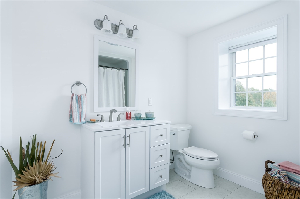 6 Carlson's Way Rutland, MA 01543 - Photo 23 of 34 a bathroom with a toilet sink and mirror