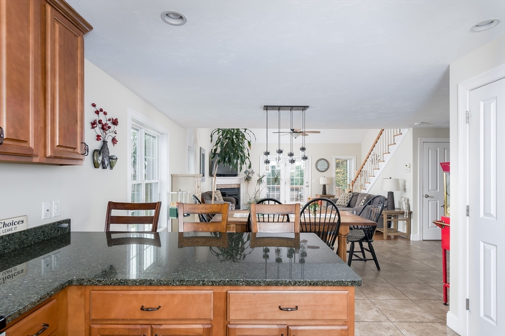 6 Carlson's Way Rutland, MA 01543 - Photo 6 of 34 a kitchen with granite countertop lots of white furniture a dining table and chairs
