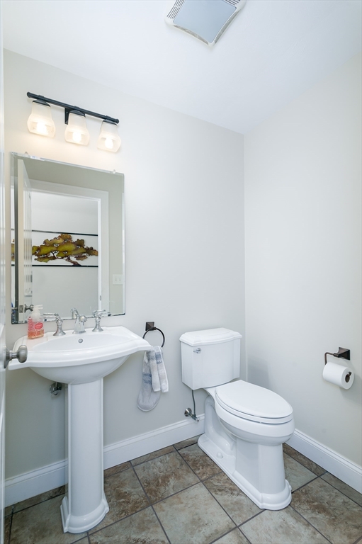 6 Carlson's Way Rutland, MA 01543 - Photo 10 of 34 a bathroom with a toilet sink and mirror