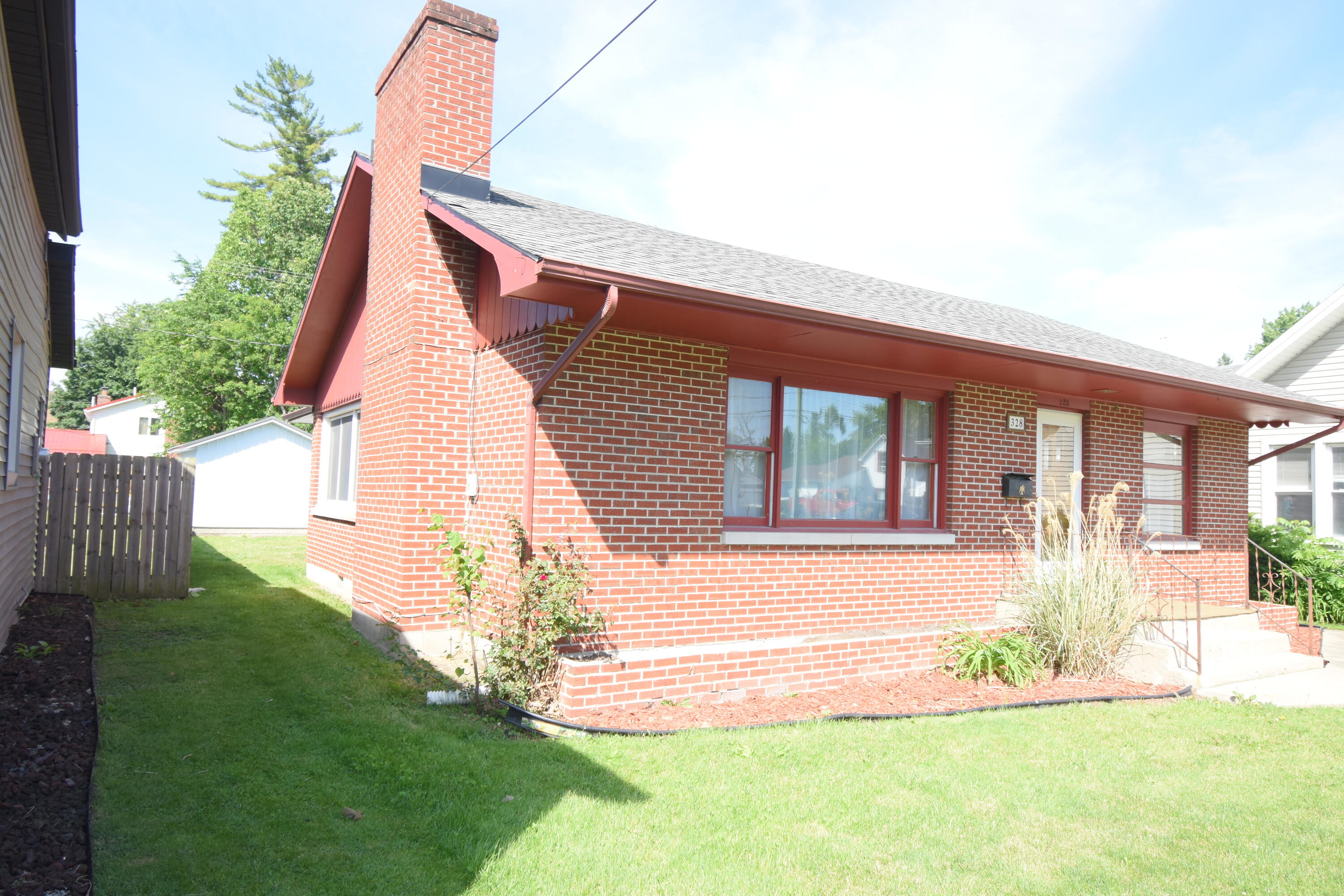 328 South Weston Street Rensselaer, IN 47978 - Photo 31 of 39 a front view of a house with a yard