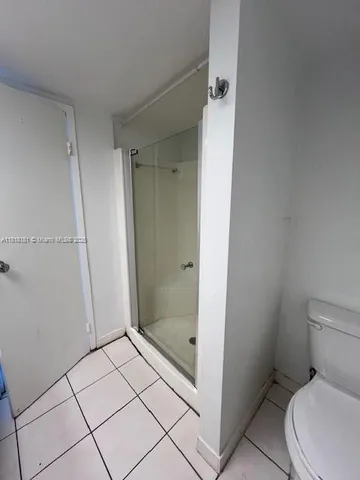 a bathroom with a sink a mirror and a shower