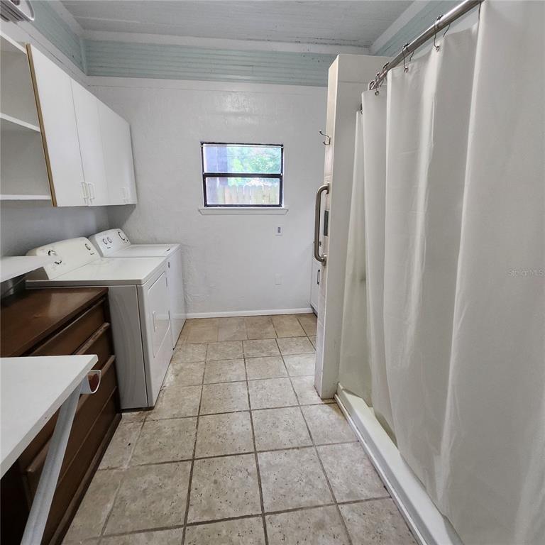 809 Northwest 4th Avenue Gainesville, FL 32601 - Photo 13 of 15 a view of a kitchen with a sink and a stove top oven