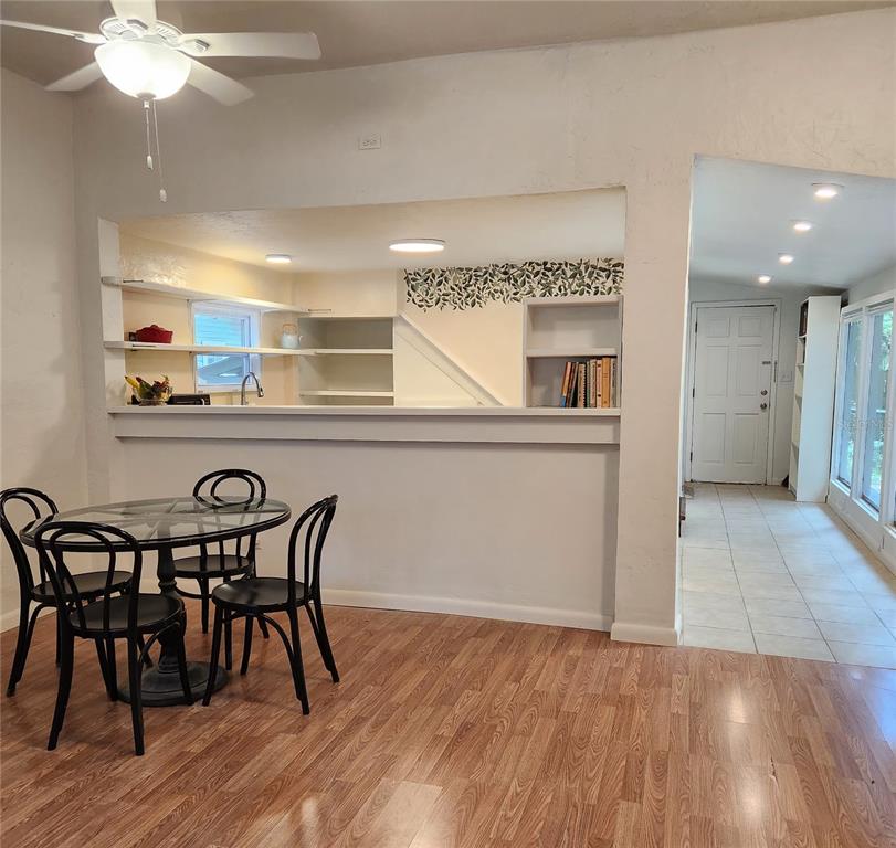 809 Northwest 4th Avenue Gainesville, FL 32601 - Photo 3 of 15 a view of a dining room with furniture and wooden floor