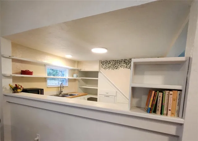 a kitchen with a stove a sink and a refrigerator