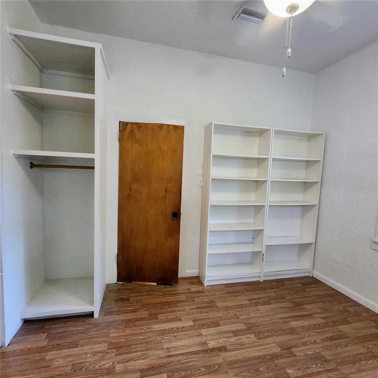 809 Northwest 4th Avenue Gainesville, FL 32601 - Photo 7 of 15 a view of a room with an empty space and wooden floor