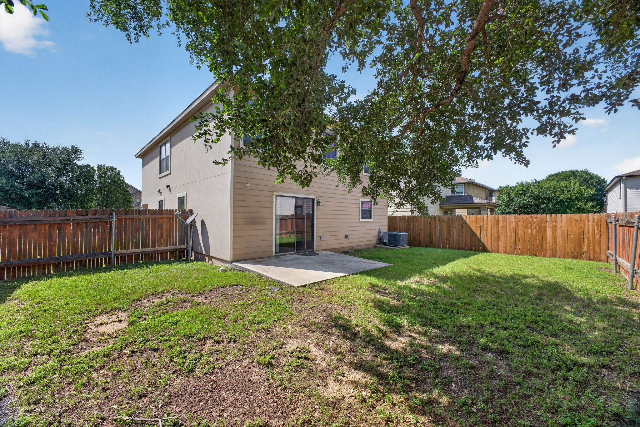 8813 Wiley Way Austin, TX 78747 - Photo 30 of 39 A spacious, enclosed backyard offers a private outdoor oasis for relaxation and entertainment.