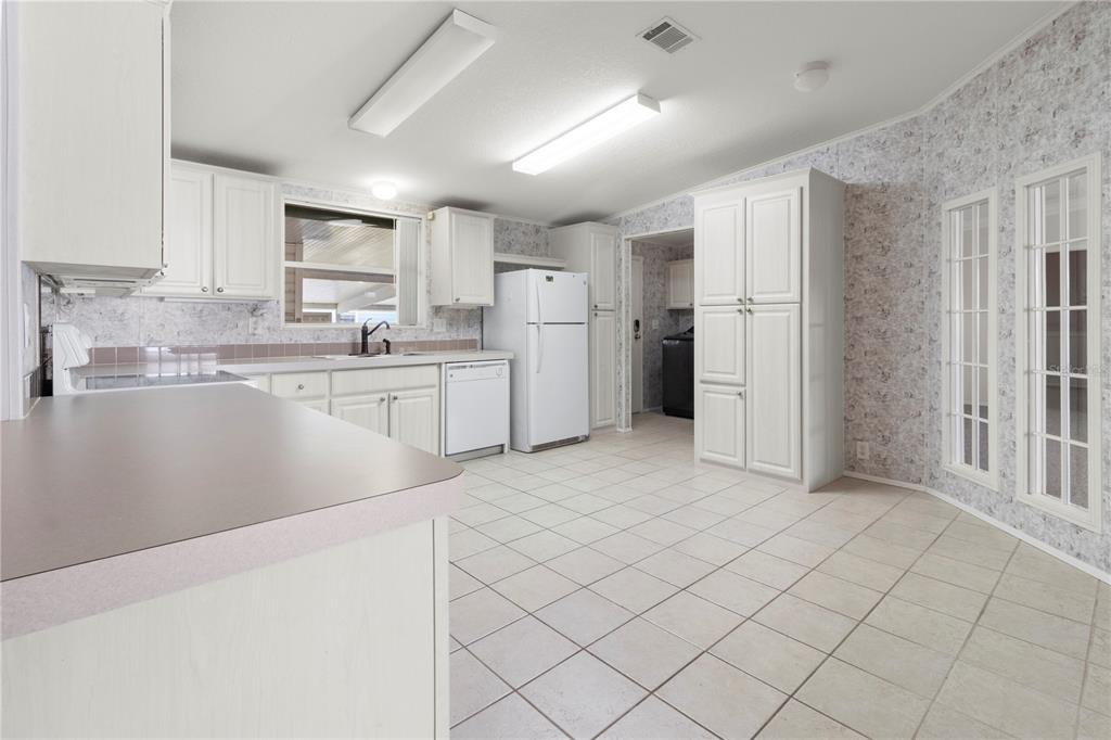 8307 Nancy Lane Ellenton, FL 34222 - Photo 12 of 57 a open kitchen with cabinets and stainless steel appliances