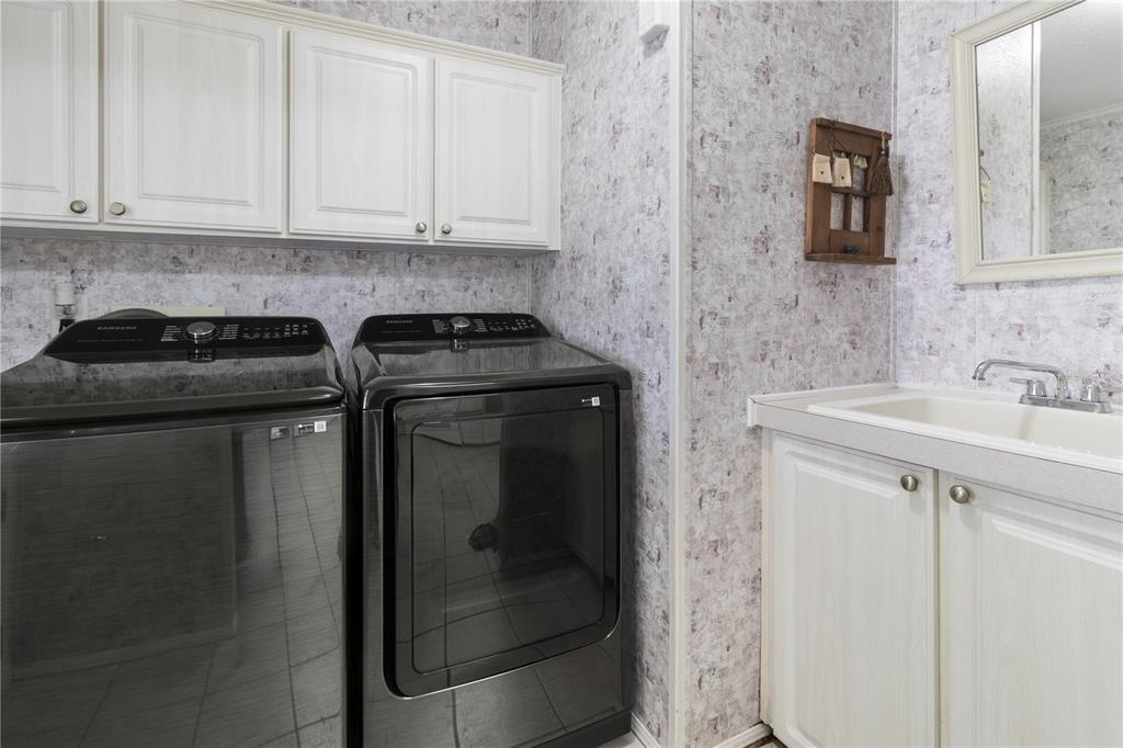 8307 Nancy Lane Ellenton, FL 34222 - Photo 16 of 57 a kitchen with stainless steel appliances granite countertop white cabinets and a granite counter tops