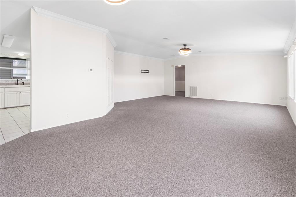 8307 Nancy Lane Ellenton, FL 34222 - Photo 21 of 57 an empty room with closet and a ceiling fan