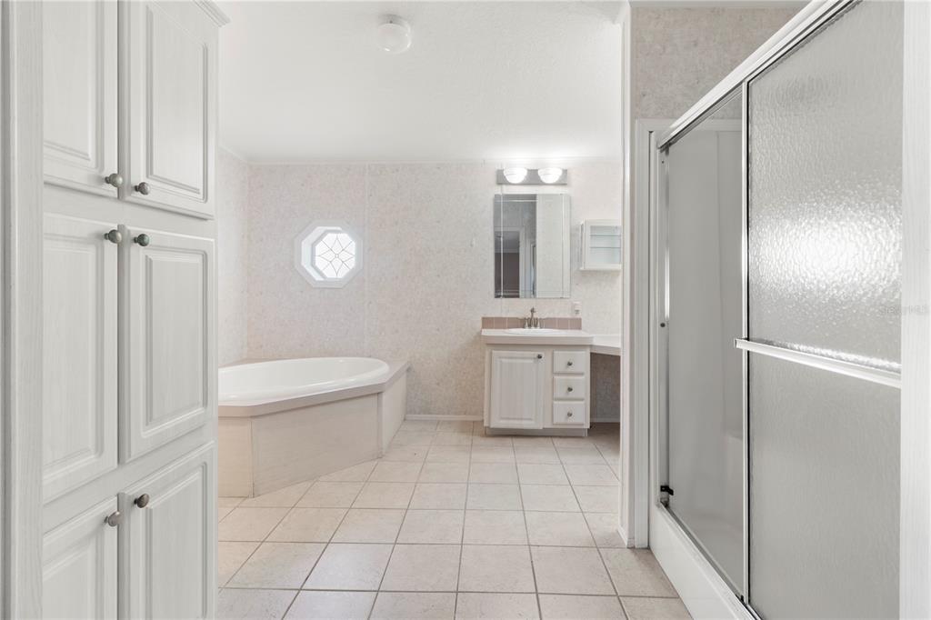 8307 Nancy Lane Ellenton, FL 34222 - Photo 28 of 57 a bathroom with a toilet a sink a shower and mirror