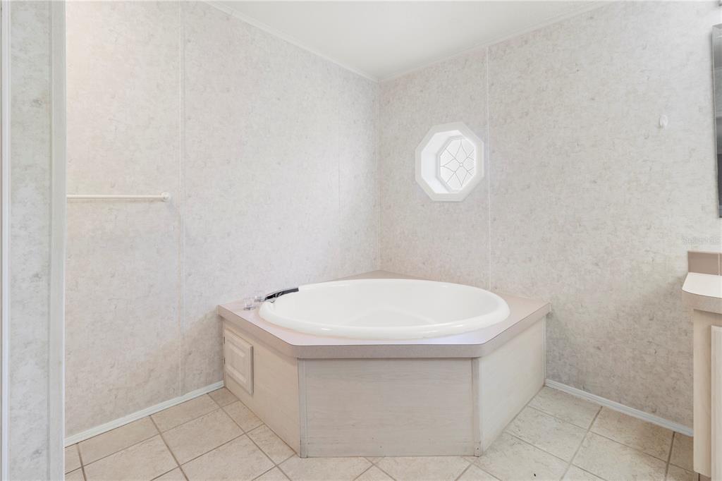 8307 Nancy Lane Ellenton, FL 34222 - Photo 29 of 57 a bathroom with a white toilet