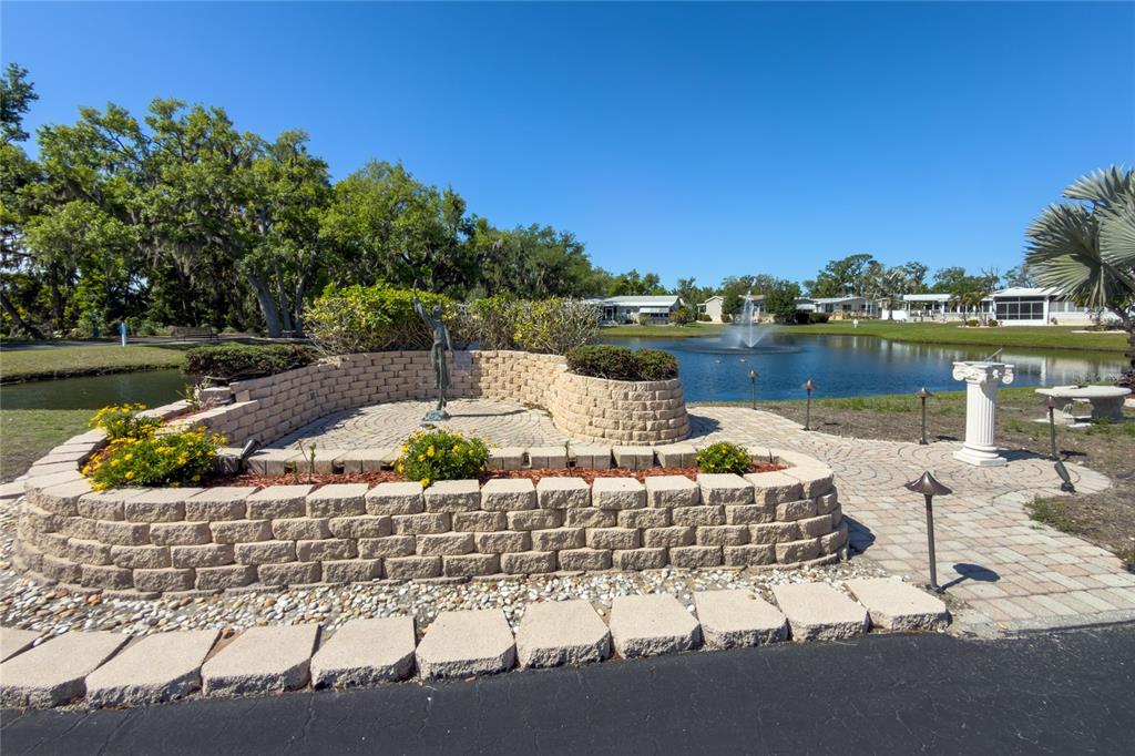 8307 Nancy Lane Ellenton, FL 34222 - Photo 49 of 57 a view of a lake with a house in the background