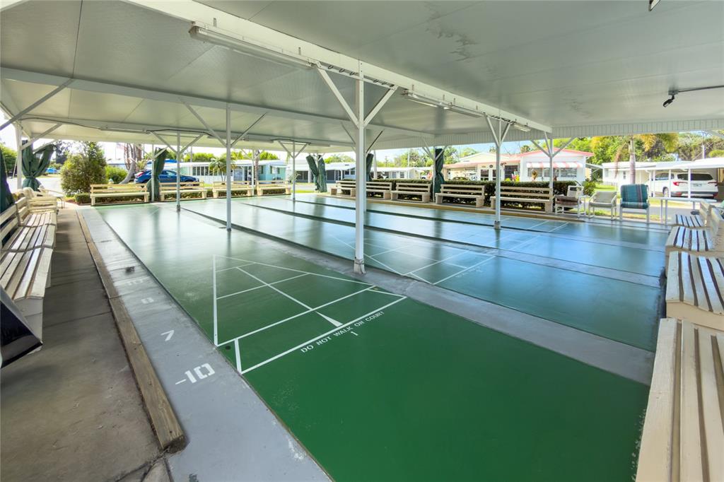 8307 Nancy Lane Ellenton, FL 34222 - Photo 52 of 57 a view of a swimming pool with an outdoor seating