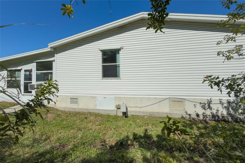 8307 Nancy Lane Ellenton, FL 34222 - Photo 8 of 57 a view of a house with a yard and potted plants
