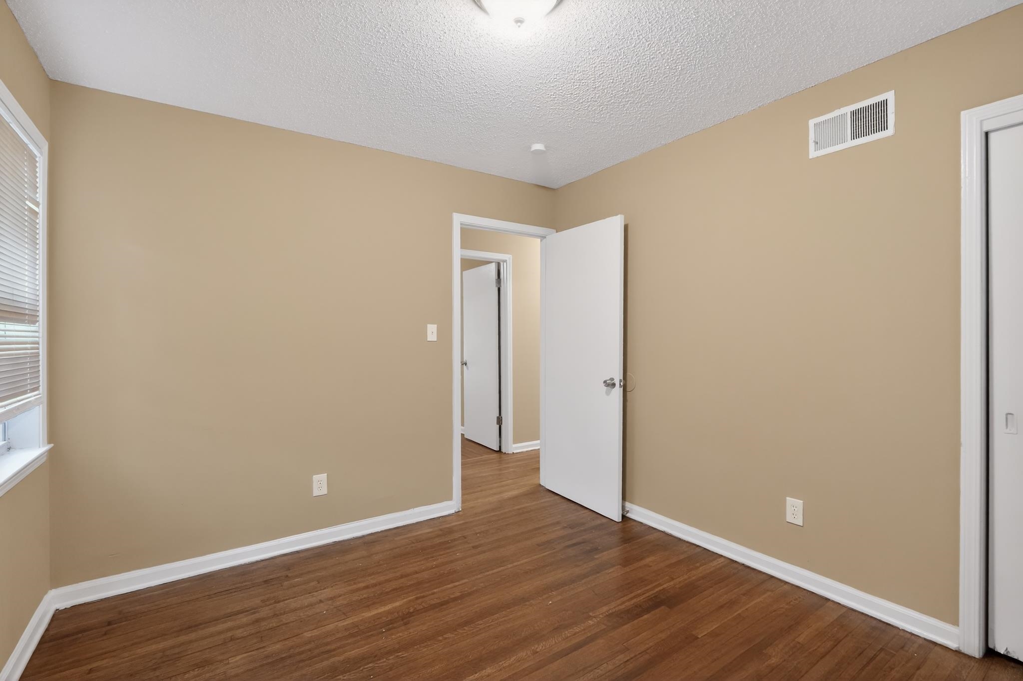 2015 East Holmes Road Memphis, TN 38116 - Photo 29 of 34 a view of an empty room with wooden floor