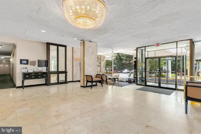 a view of living room with furniture and floor to ceiling window