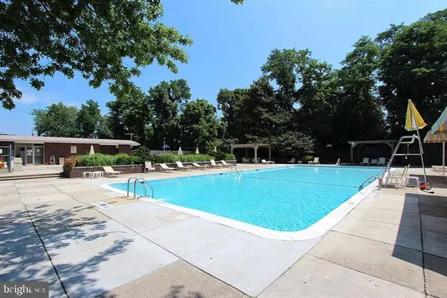 a view of a swimming pool with a patio