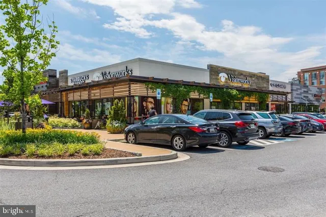 a view of a patio with a table and chairs