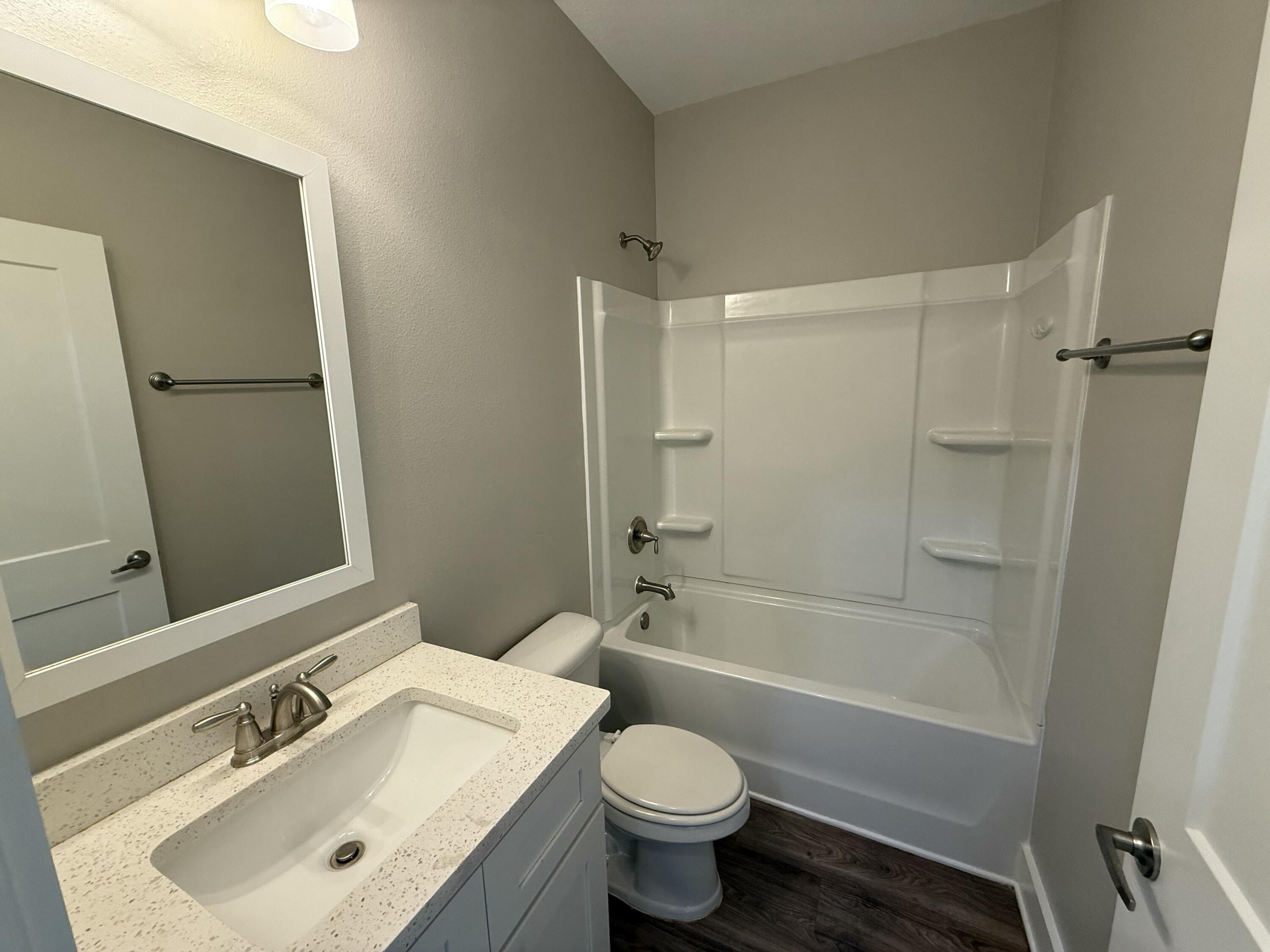 142 North Sand Palm Road Freeport, FL 32439 - Photo 18 of 26 a bathroom with a sink toilet and shower