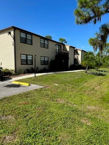 a view of swimming pool with house in background