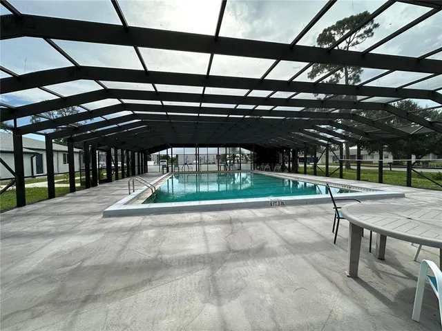 a view of a porch with chairs and backyard