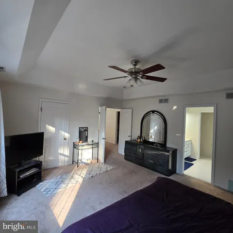 a view of living room with furniture and a flat screen tv