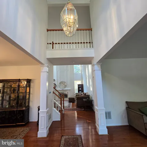 a view of entryway livingroom and hall with wooden floor