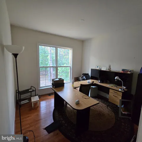 a workspace with furniture and a window