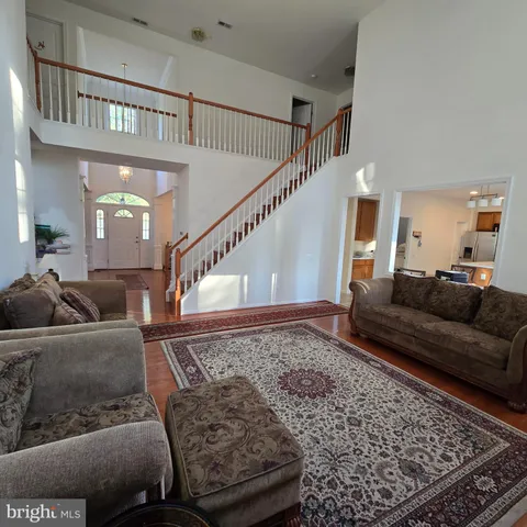 a living room with furniture and a rug