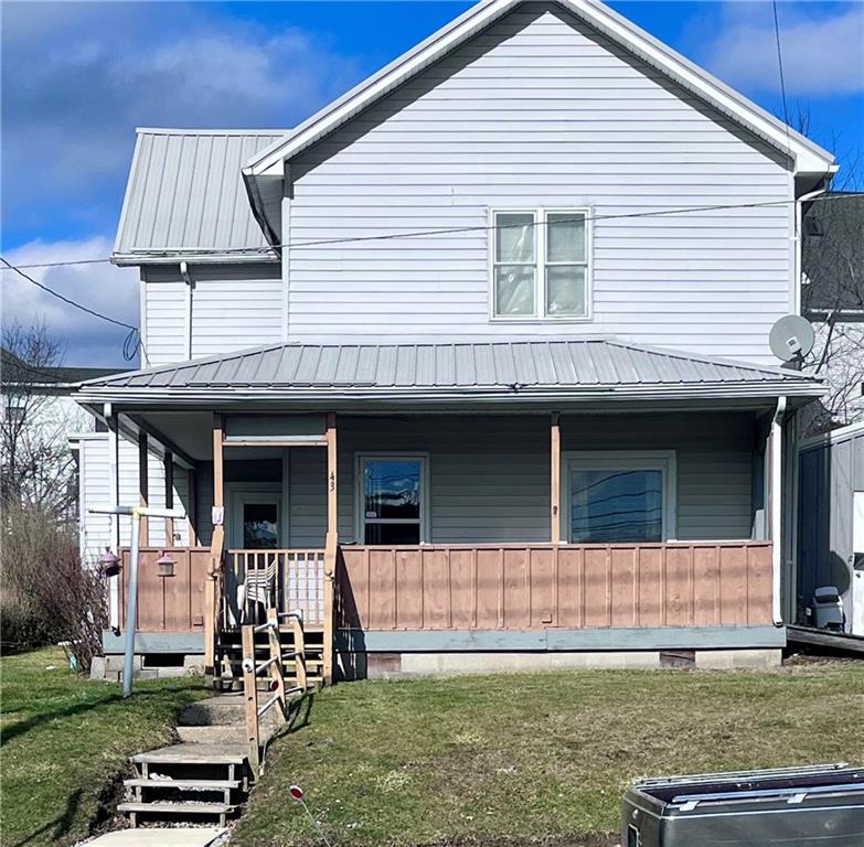 43 West Main Street Yatesboro, PA 16263 - Photo 1 of 20 a front view of a house with a yard