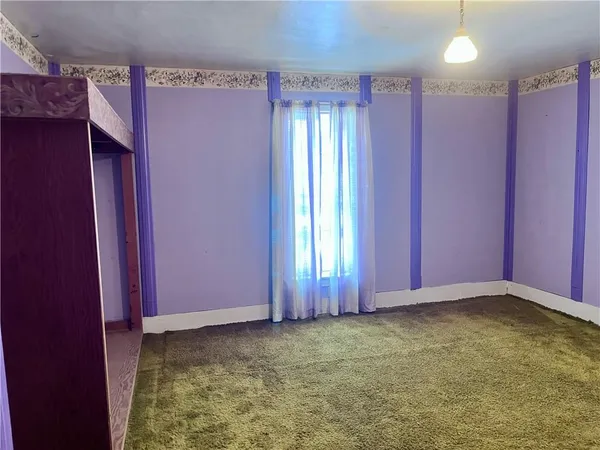 a view of an empty room with window
